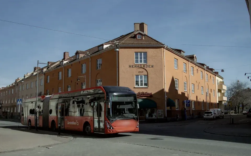 Electric bus driving through a city in winter