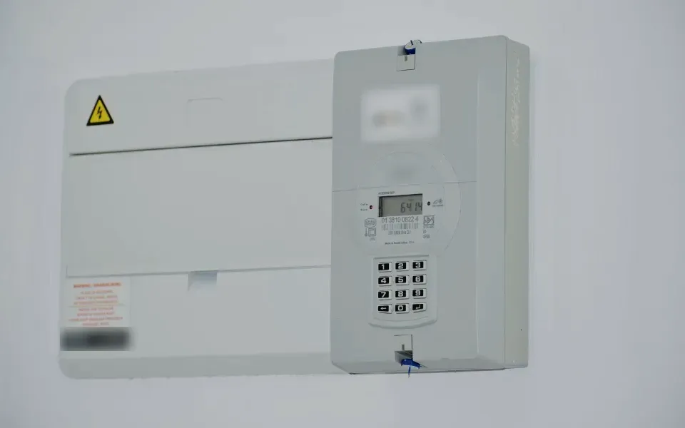 Smart electricity meter mounted on a wall